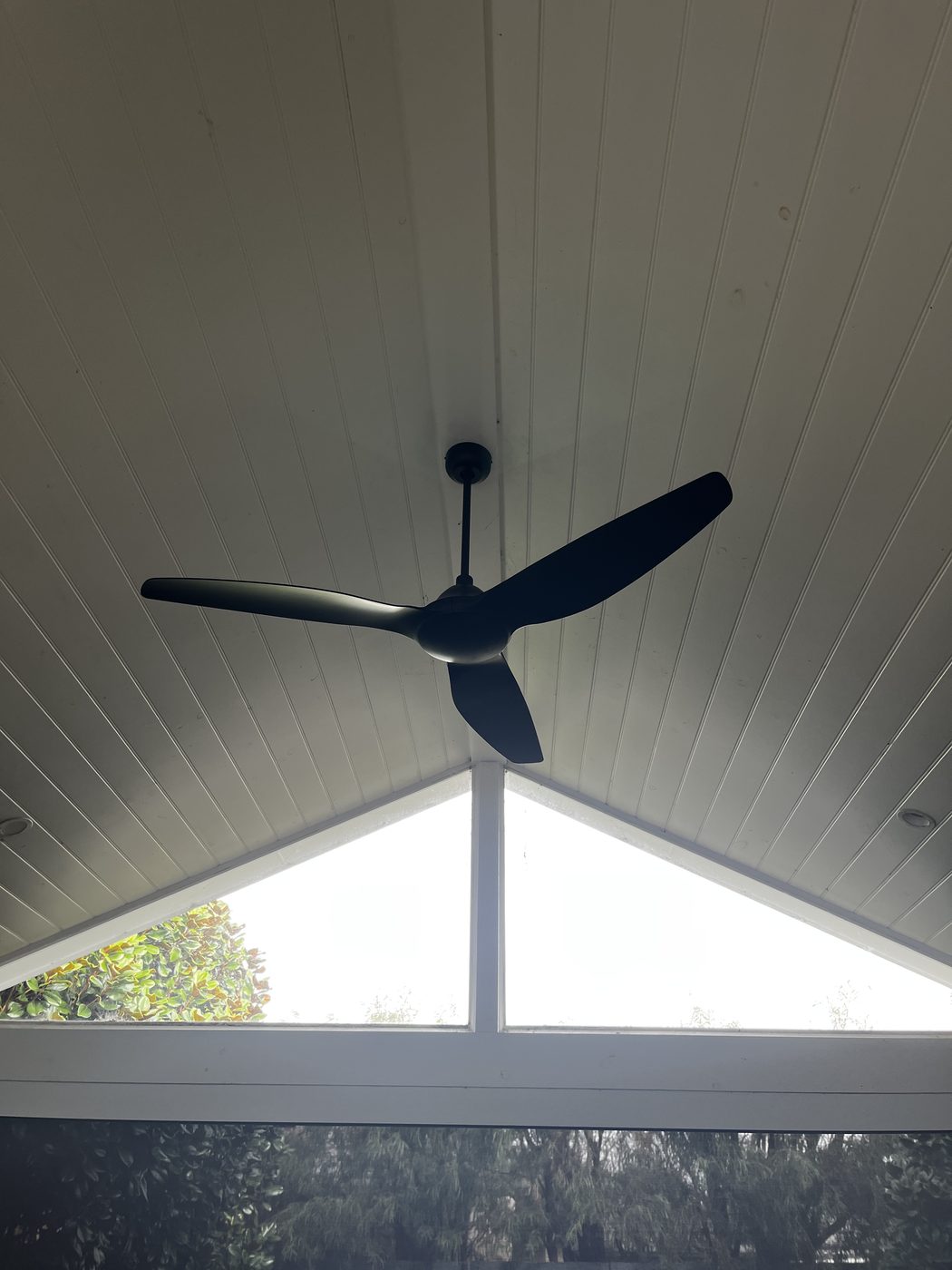 Ceiling fan installed on a raked alfresco ceiling with a drop rod by SALTD Electrical