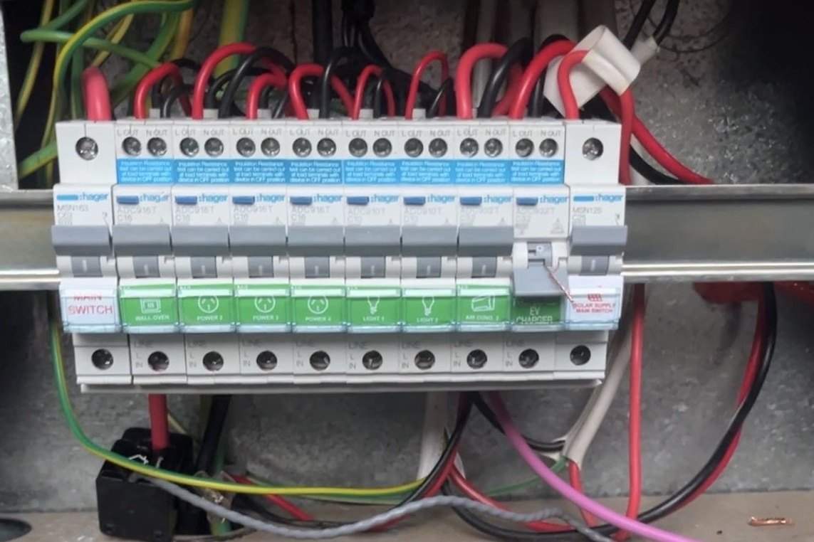 Switchboard with the cover off during fault finding, every circuit labelled including the EV charger and solar supply, by SALTD Electrical